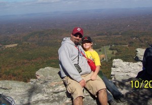 Father and son having fun at boyscout camp