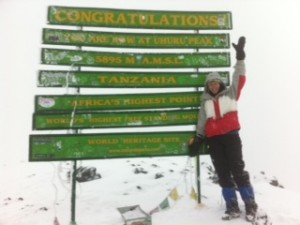 Abbi at the top of Mt. Kilimanjaro