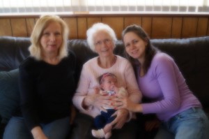 Mom, holding her youngest great-grandchild last year.