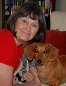 Hope, enjoying a moment with her six-month-old dachshund, Winnie.