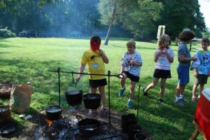 Experiencing colonial life at summer camp.