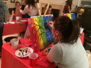 Kristin, creating a masterpiece at the painting party.