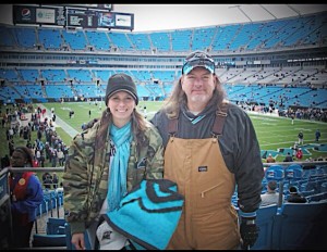 Kristin, enjoying a Carolina Panthers game with her dad.