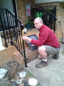 Conley Myers putting the finishing touches on my new hand rail. Love the look. Thanks, Conley.