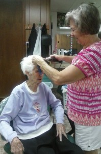 A day in the life of a cosmetologist, fixing hair and being a friend. In this photo, Debbie is fixing my mom's hair.