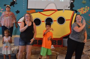 Learning new songs at Vacation Bible School. Sandi is far left and her daughter, Kathi, far right.