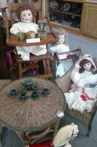 Dolls having a tea party at the Spencer Doll Museum.