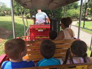 Riding the train at the Kannapolis splash pad park.